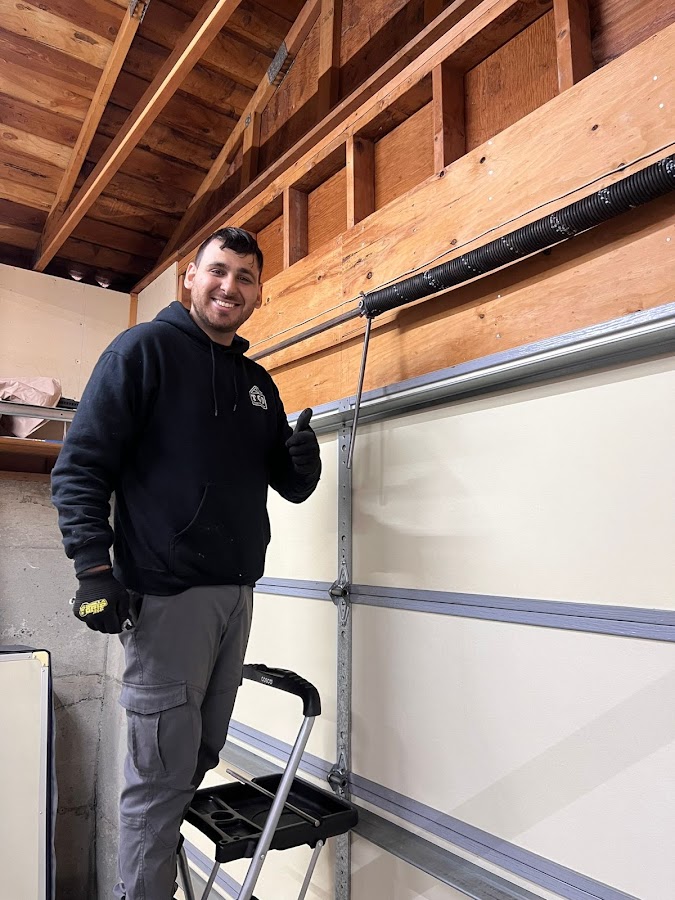 Tomys garage door Garage Door Repair photo